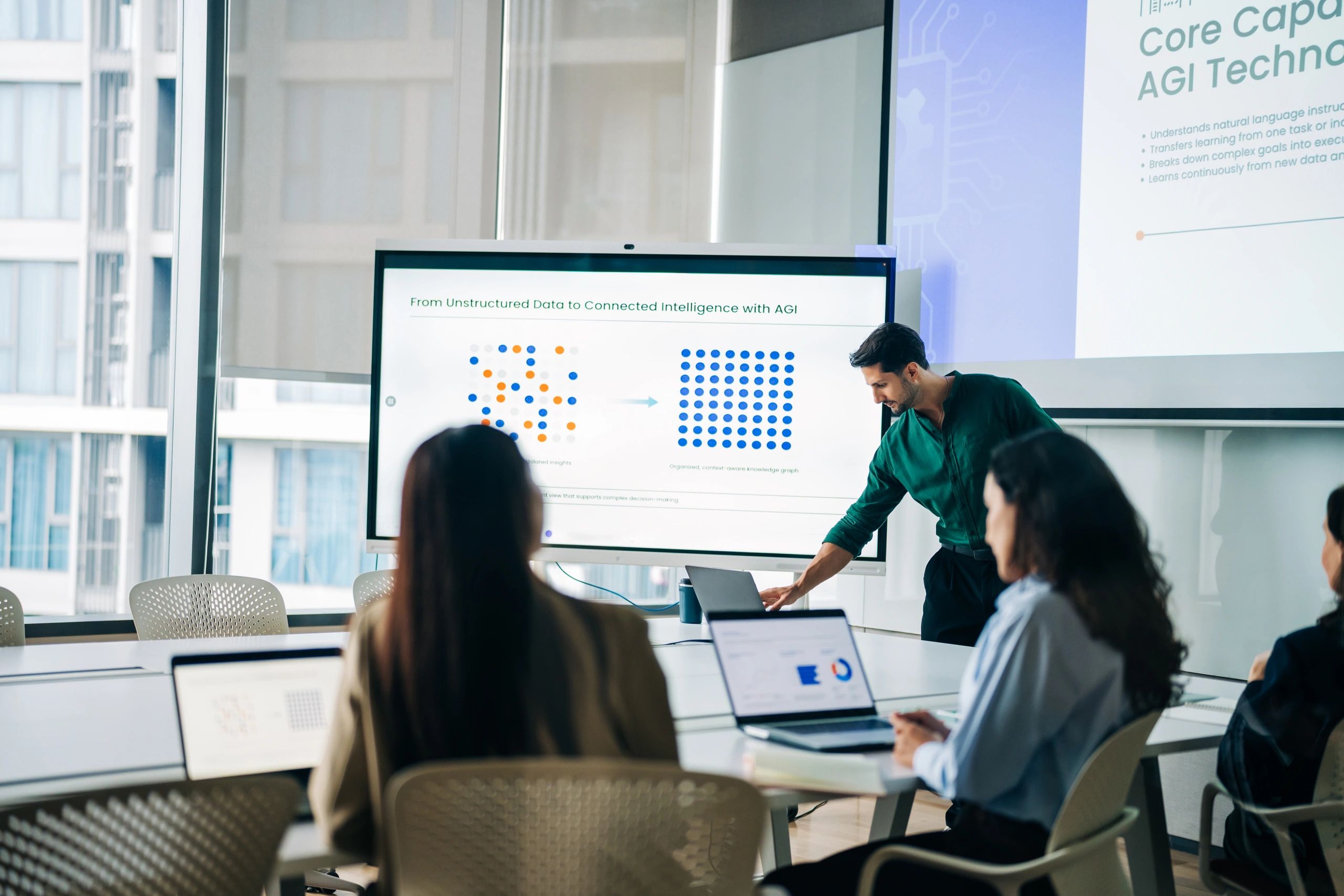 Professional Man Presenting AGI Analytics on Digital Screen